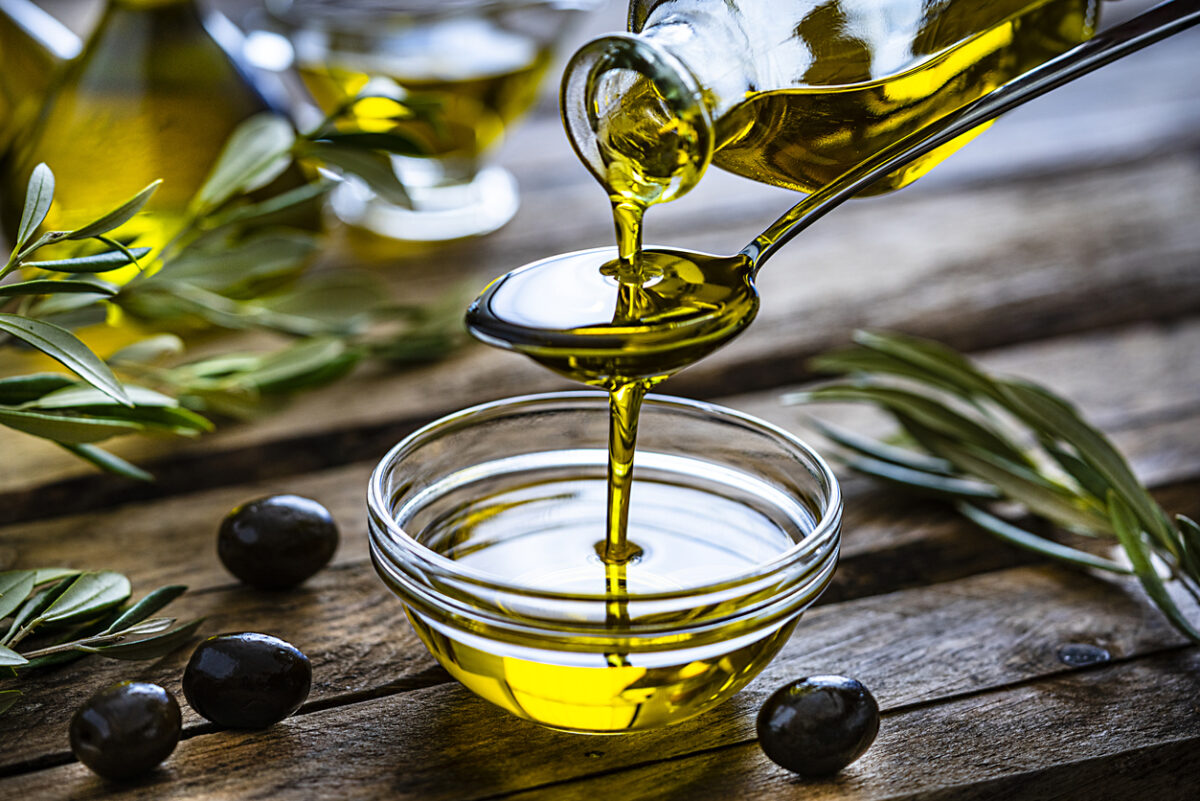 Pouring olive oil into bowl