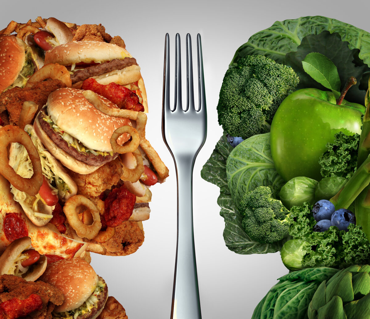 junk food vs healthy food concept with foods in shape of faces looking at each other into a silver fork in the middle