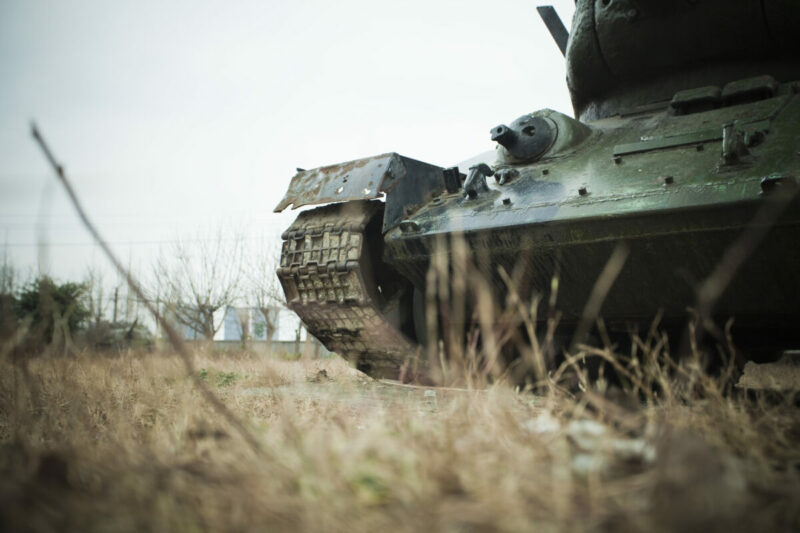 Close up of tank in desolate field, shot from below