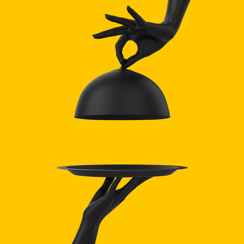 Black Dish with lid holding hands isolated on yellow, opened restaurant cloche, launch time promo banner concept