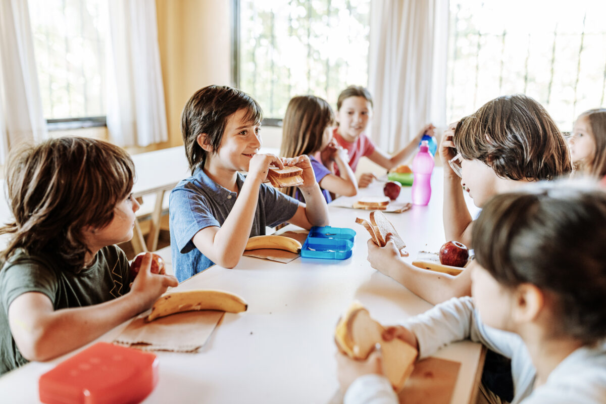 children eating in school canteen