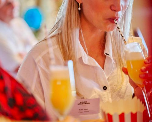 person tasting drinks