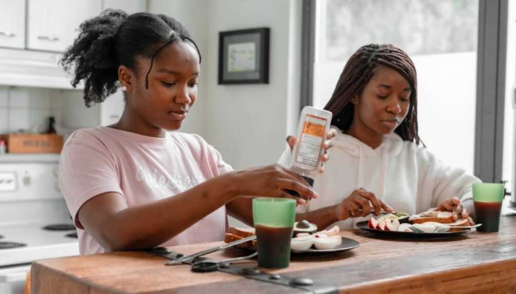 two young girls eating