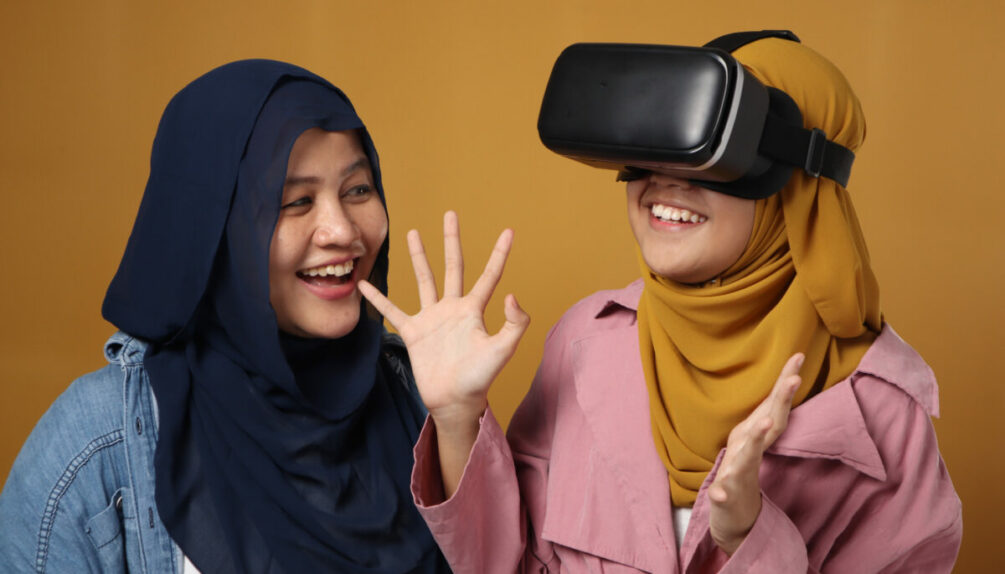 Two girls using VR glasses