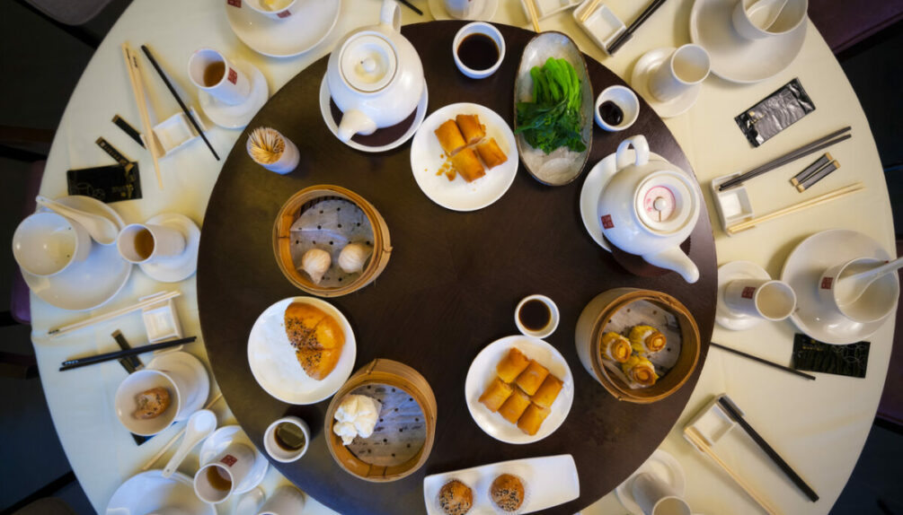 Cutlery and recepticles on dining table in Chinese restaurant