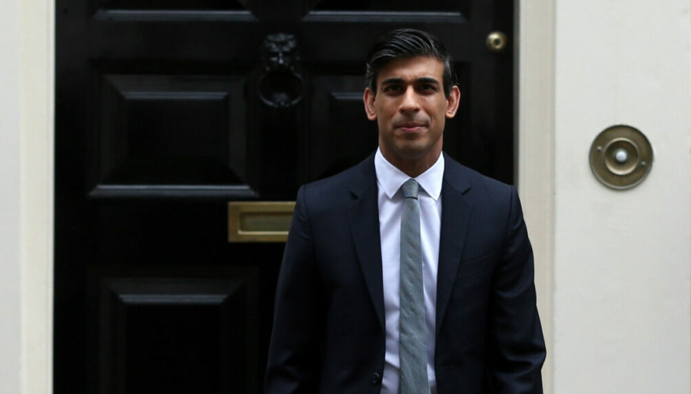 Man in suit standing by door