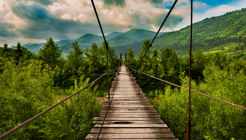 Suspension bridge over the mountain river Striy in the Carpathian National Park