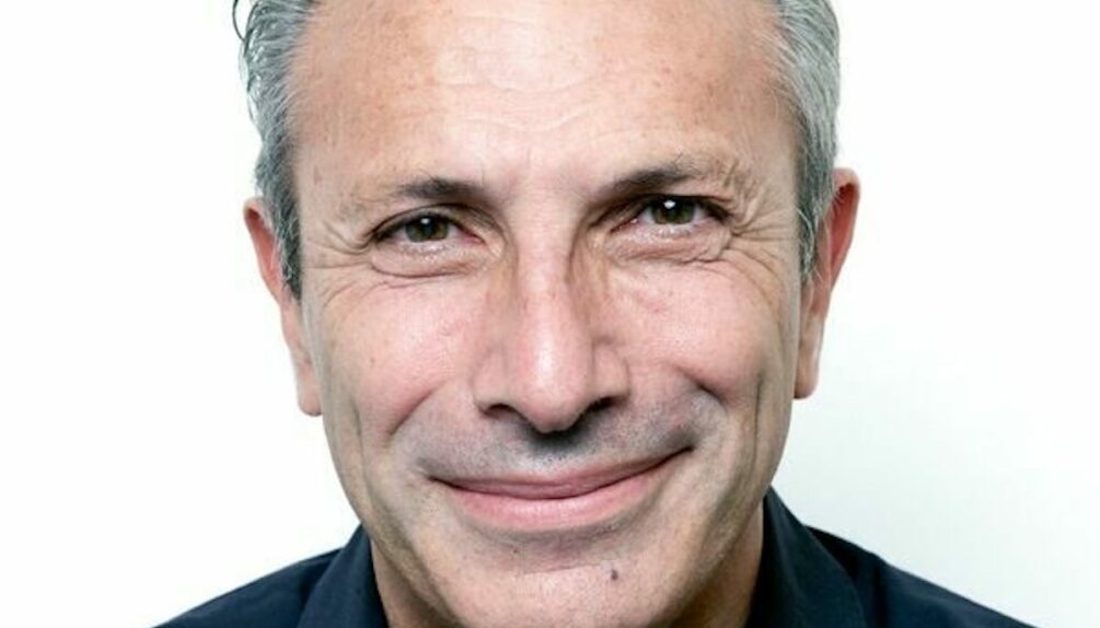 man in black shirt smiling