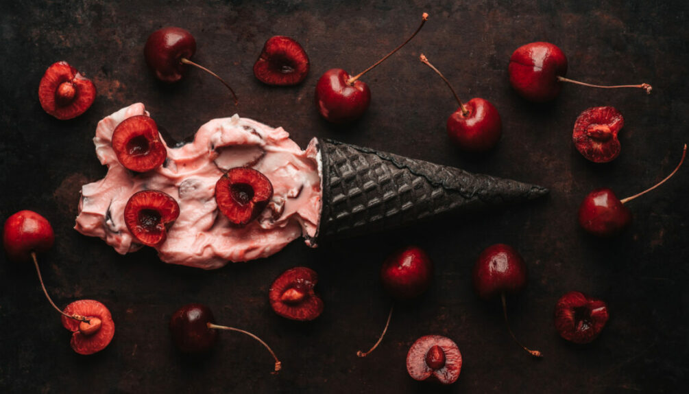Cherry ice cream on the dark rustic background