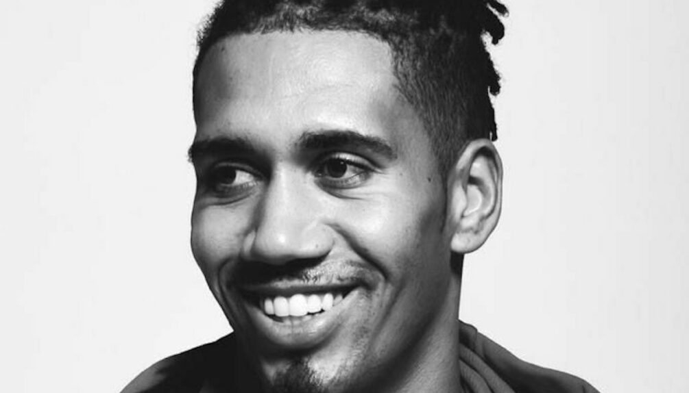 black and white picture of young black man with dreadlocks