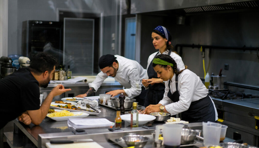 trainees being taught in a kitchen