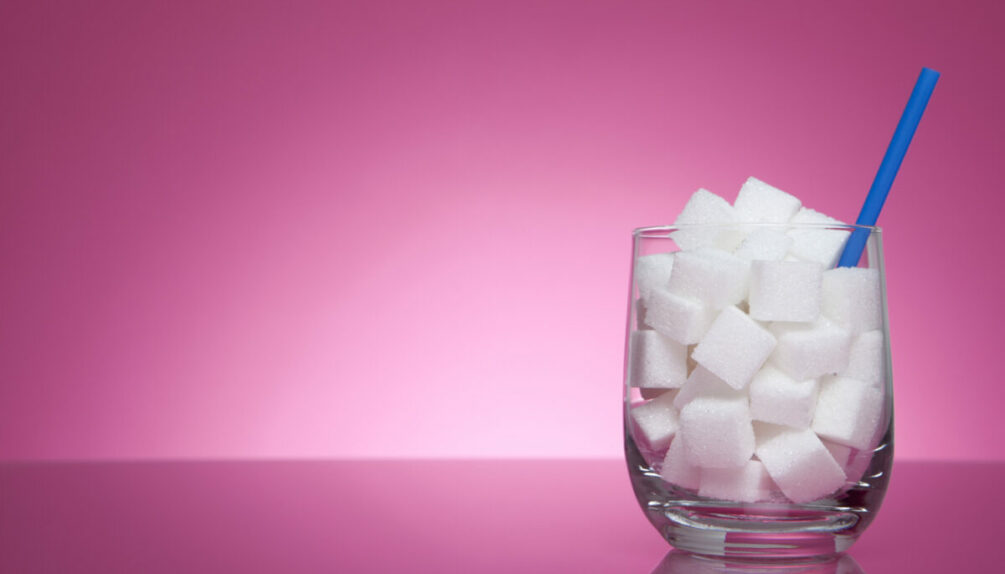 Glass filled with sugar cubes