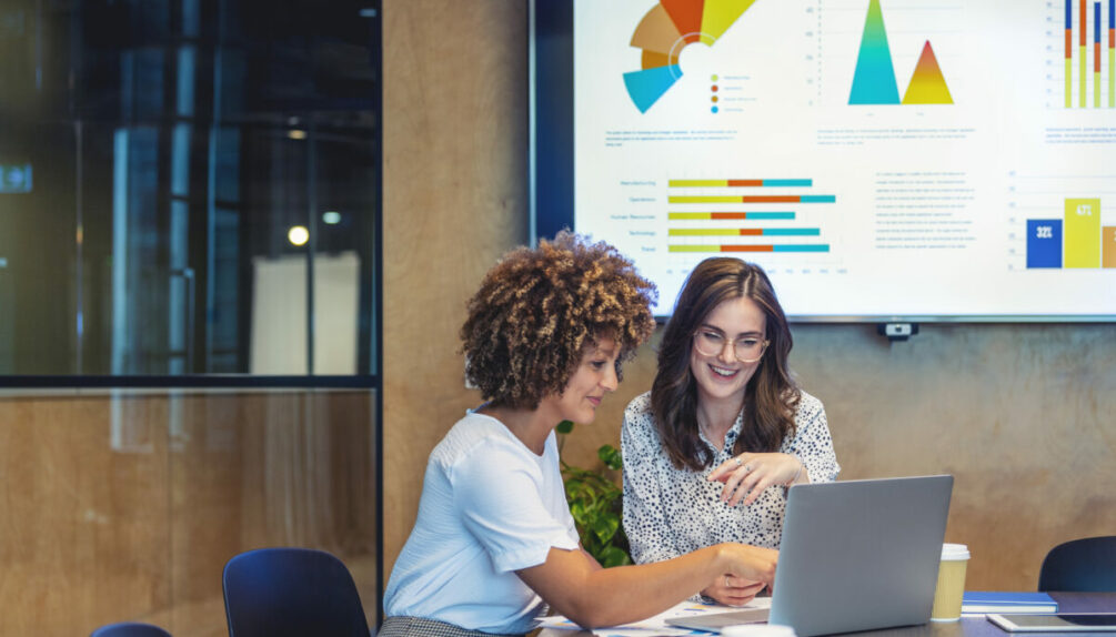 Business colleagues working together on a laptop