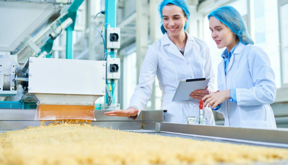 Young women working at food factory