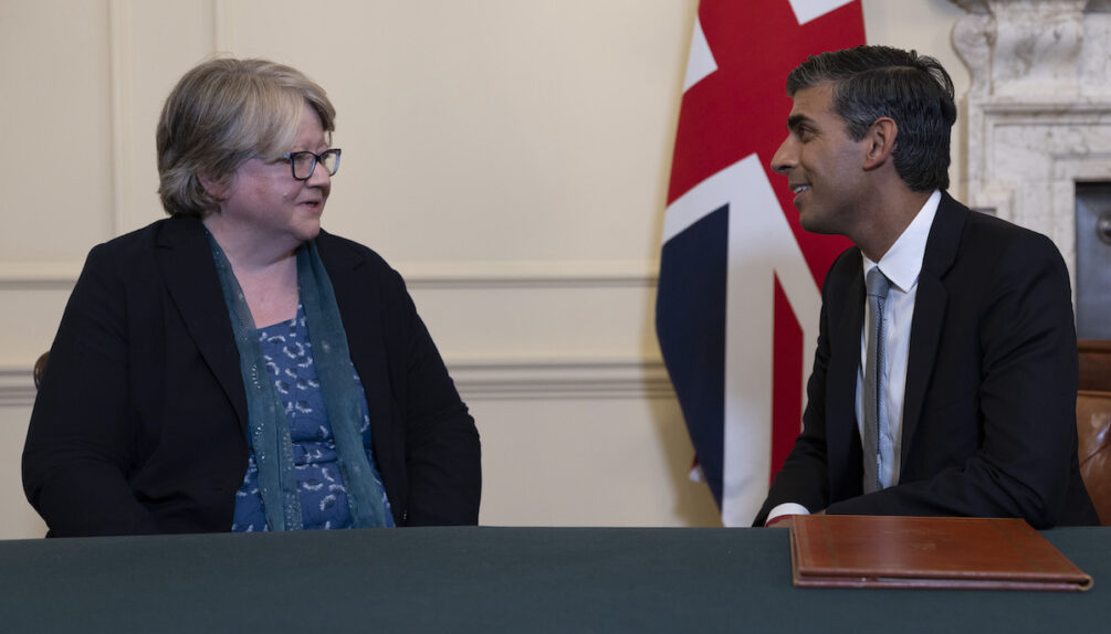 British PM Rishi Sunak speaking to Director of Defra, Thérèse Coffey, UK flag in background