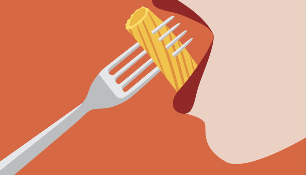 Woman eating pasta