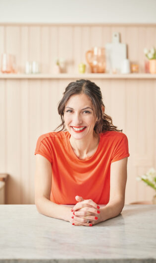 Dominique Woolf smiling in kitchen