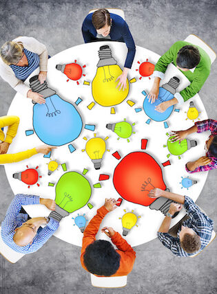 Multiethnic Group of People Meeting with Light Bulb Symbol - collaboration