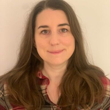 image of woman wearing a plaid shirt