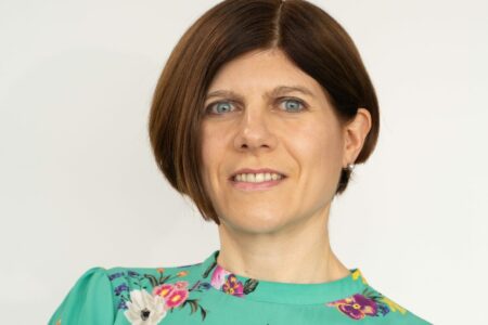 woman wearing a floral green top