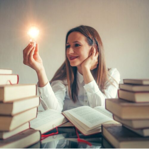 Woman looking at a light bulb