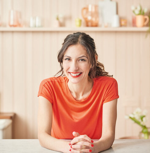 Dominique Woolf smiling in kitchen