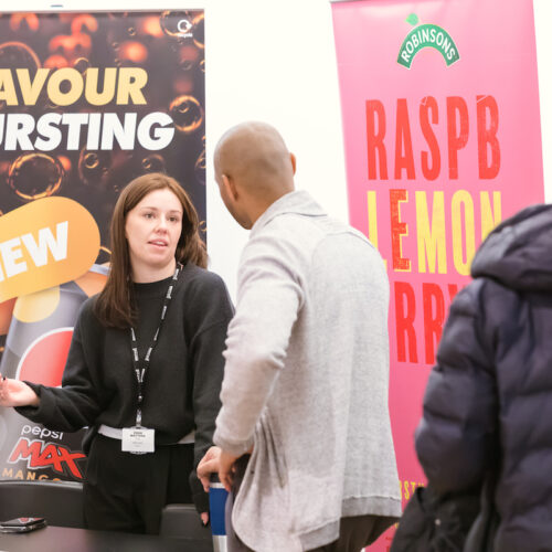 The future of food marketing. A marketeer talks to a member of the public at a food and drink industry event