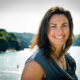 Woman with dark hair smiling