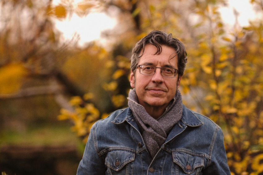 George Monbiot standing in a forest in autumn close-up